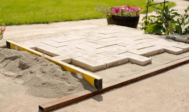 paving-stone-diy-pave-pavement-bricklayer-men-working-outdoor-slab-job-cottagecore-real-people-garden_t20_6YGjwN